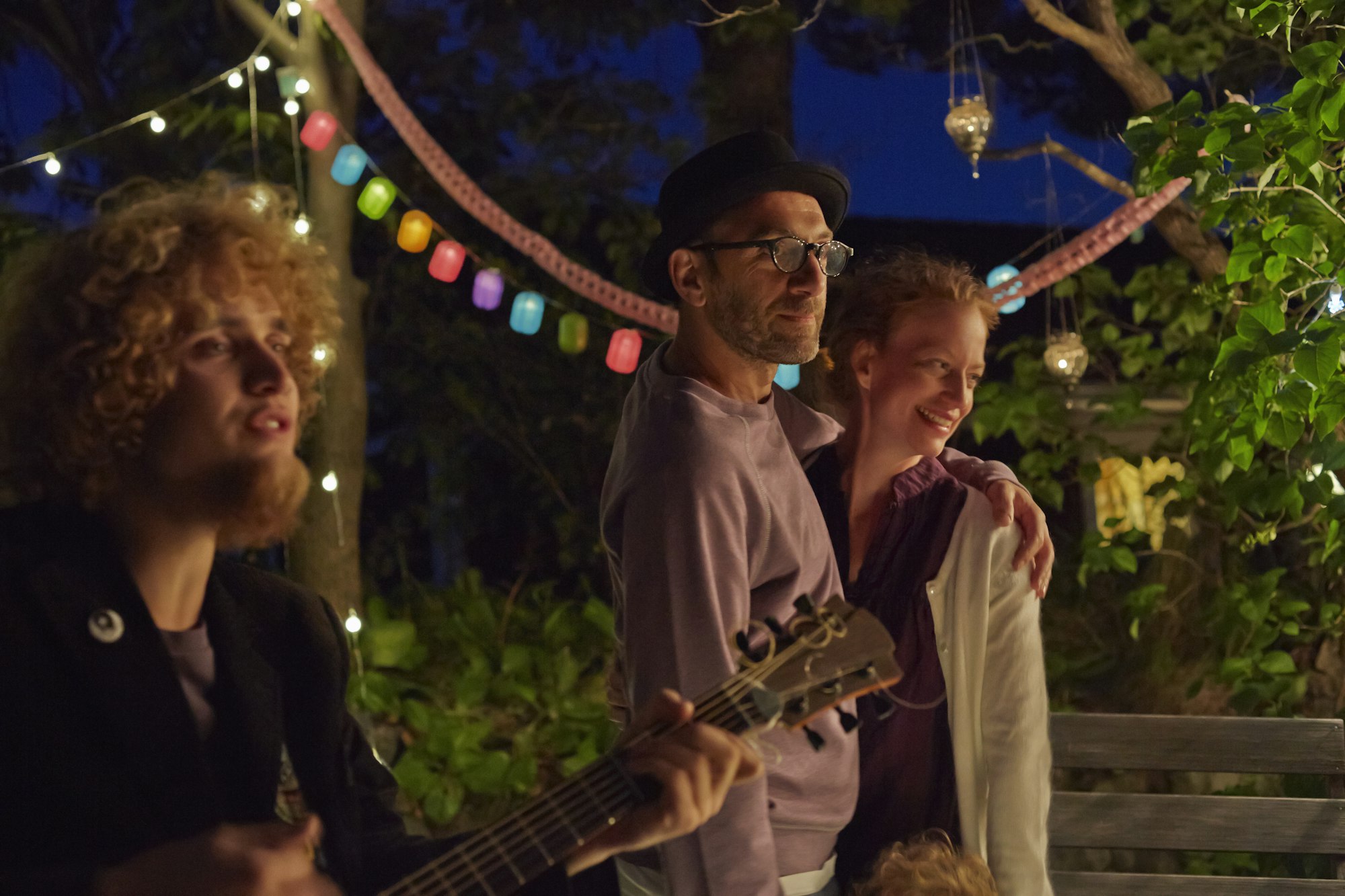 Couple enjoying garden party at night